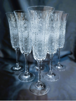 Cut tall champagne glasses,...